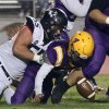 Lemoore's Ty Chambers recovers his fumble in the fourth quarter Friday night in Tiger Stadium.